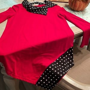 Red long sleeve with black & white polka dot collar and left bottom